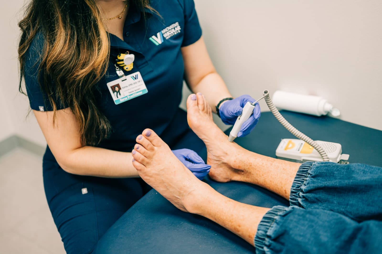 IVI clinician examining a patient's foot with care